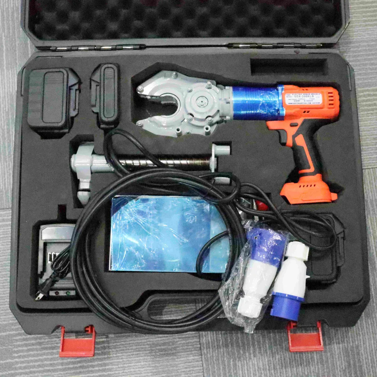 SDX-200RLB Electric Rebar Coupler Wrench displayed with battery and AC adapter power options