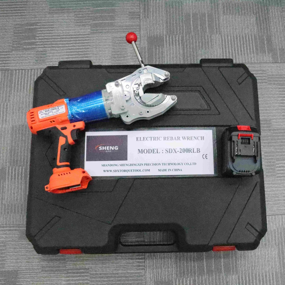 SDX-200RLB Electric Rebar Coupler Wrench shown beside its carrying case and visible kit items