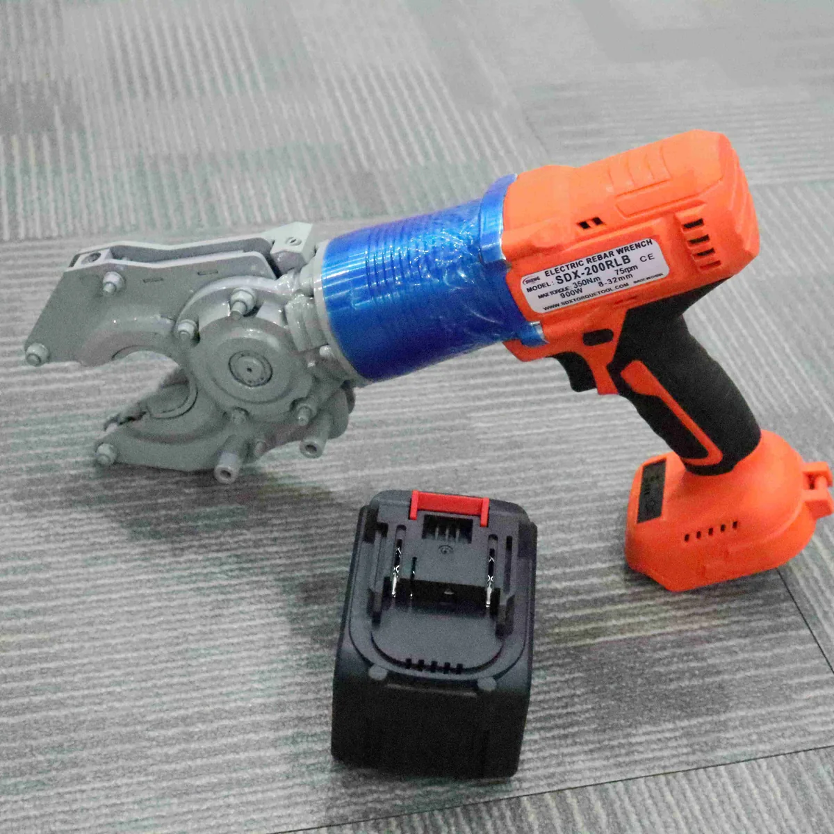 SDX-200RLB Electric Rebar Coupler Wrench with a battery pack visible